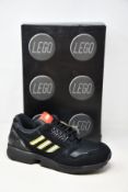 A pair of as new Adidas ZX 8000 Lego black sneakers (UK 10.5).