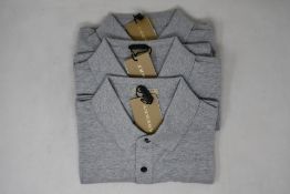 Three as new Burberry polo shirts in grey (XL).