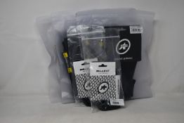 Four pairs of as new Assos Spring Fall leg warmers (RRP £50 each) and two pairs of Assos Mille GT