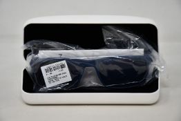 A pair of as new Calvin Klein sunglasses.