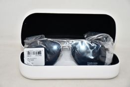 A pair of as new Calvin Klein sunglasses.