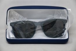 A pair of as new Lacoste sunglasses.