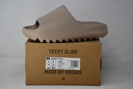 A pair of as new Adidas Yeezy Slide (UK 8).