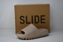 A pair of as new Adidas Yeezy Slide (UK 4).