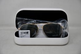 A pair of as new Calvin Klein sunglasses.