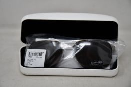 A pair of as new Calvin Klein sunglasses.