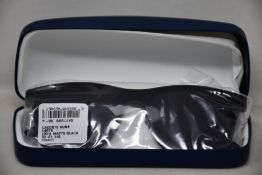 A pair of as new Lacoste sunglasses.