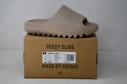 A pair of as new Adidas Yeezy Slide (UK 5).