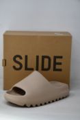 A pair of as new Adidas Yeezy Slide (UK 7).