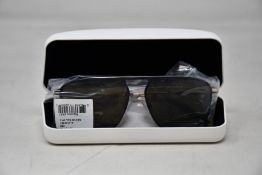 A pair of as new Calvin Klein sunglasses.