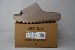 A pair of as new Adidas Yeezy Slide (UK 8).