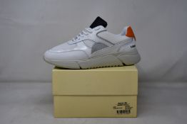 A pair of as new Axel Arigato Genesis Triple sneakers (UK 6).