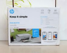 A boxed as new HP DeskJet 2720 All-in-One Printer (Box sealed, damage to box).
