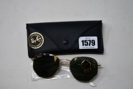 A pair of as new Ray Ban sunglasses.