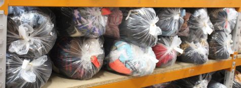 Twelve bags of pre-owned clothing and related items.