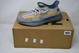 A pair of as new Adidas Yeezy Boost 350 V2 with authentication tag (UK 8.5).