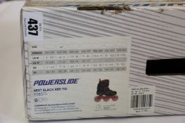 A boxed as new pair of Powerslide Next 110 skates in Black/Red (Size UK 5-6).
