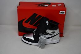 A pair of women's as new Nike Air Jordan 1 High OG (UK 8).