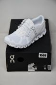 A pair of women's as new On Running All White running trainers (UK 4).