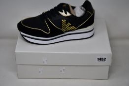 A pair of as new Emproio Armani sneakers (UK 7).