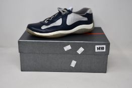 A pair of pre-owned Prada sneakers with authentication tag (Size 7 - some scuffing marks on toes).