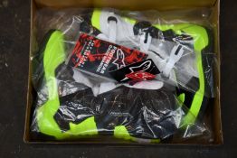 A pair of youths boxed as new Alpine Stars Tech 3S Off-road Boots in back, white and fluorescent