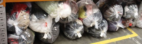 Twelve bags of pre-owned clothing and related items.