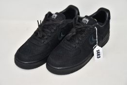 A pair of as new Nike x Stussy Air Force 1 Low sneakers (UK 8.5 - No box).