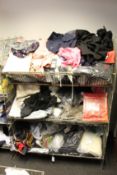 A quantity of assorted as new clothing and related items.
