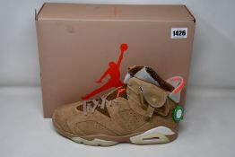 A pair of as new Nike Jordan 6 Retro Travis Scott with authentication tag (UK 10.5 - slight