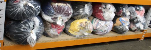 Twelve bags of pre-owned clothing and related items.