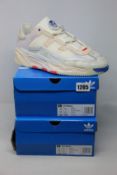 Two pairs of as new Adidas Niteball trainers (UK 9.5).
