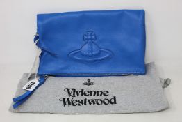 An as new Vivienne Westwood Chelsea clutch in blue leather (RRP £325).