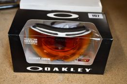 A pair of Oakley Flight Deck FP White with Prizm Torch (L).