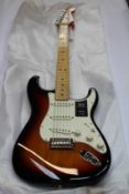 An as new Fender Player Series Stratocaster in 3 Tone Sunburst (MN 3TS).