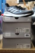 Two pairs of as new Adidas Supernova + M trainers (UK 10).
