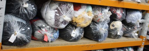 Twelve bags of pre-owned clothing and related items.