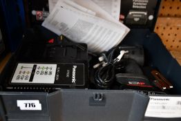 A Panasonic cordless impact driver dual 14.4V/18V with two 5.0Ah li-ion batteries and changer.