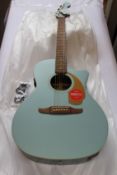 A boxed as new Fender California Series Mewporter Acoustic Guitar in Ice Blue Satin.