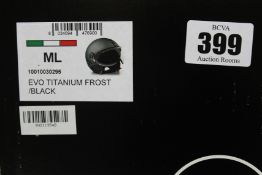 A boxed as new Momo Design EVO Fighter motorcycle helmet in Titanium Frost/Black (ML).