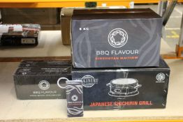 A boxed as new Yakiniku Japanese Shichirin grill, two packs of grill bricks and a 5kg of BBQ flavour