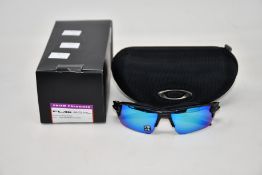 A pair of as new Oakley Flak 2.0 XL sunglasses.