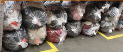 Twelve bags of pre-owned clothing and related items.