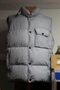 An as new Stone Island gilet (XXL).