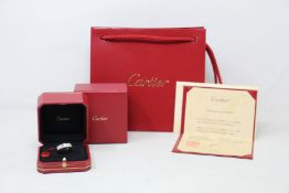 An as new Cartier LOVE ring, white gold 750/1000, set with 3 brilliant-cut diamonds totalling 0.22