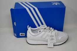 Two pairs of as new Adidas ZX 700 HD trainers (UK 10.5).