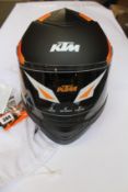 An as new KTM Factor helmet (L/30).