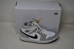 A pair of women's as new Nike Air Jordan 1 Mid (UK 5).