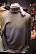An as new Arket cashmere roll neck (M).
