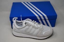 Two pairs of as new Adidas ZX 700 HD trainers (UK 10).